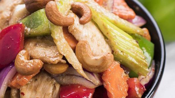 Cashew Nut Chicken · Spicy. Sliced chicken breast stir fried in our famous cashew nut sauce with red and green bell peppers, celery, carrots, red onions, and cashew nuts.