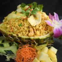 Pineapple Fried Rice · Vegetarian. Jasmine rice infused with yellow curry flavor, stir fried with pineapple, cashew...