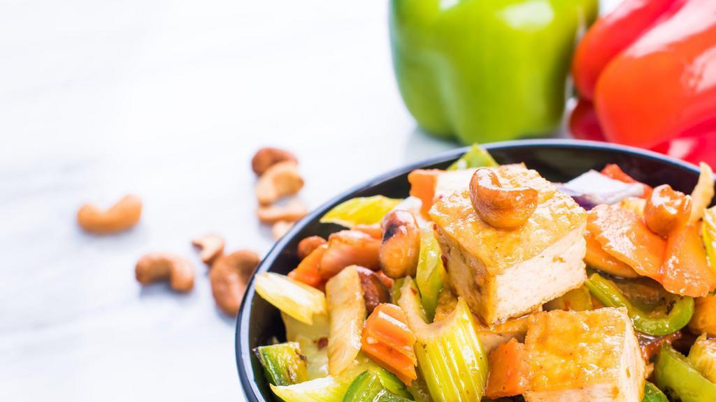 Cashew Nut Tofu · Spicy. Fried tofu and cashew nuts stir fried in our famous cashew nut sauce with red and green bell peppers, celery, carrots, and red onions.
