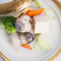 Original Tom Kah · This soup features tofu, straw mushroom caps, lemongrass, spring onions, cabbage, carrots, b...