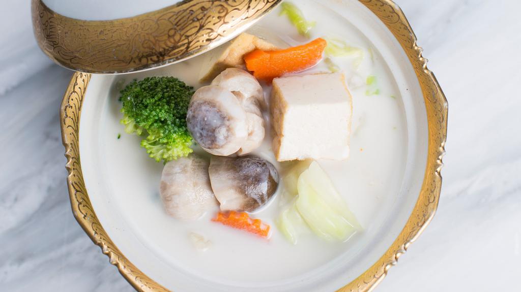 Original Tom Kah · Vegetarian. This soup features tofu, straw mushroom caps, lemongrass, spring onions, cabbage, carrots, broccoli, cilantro, and an enticing taste of galangal roots infused with coconut milk.