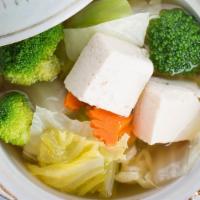Tofu Soup · A light, flavorful soup made with a clear broth, tofu, mushrooms, spring onions, cabbage, ca...