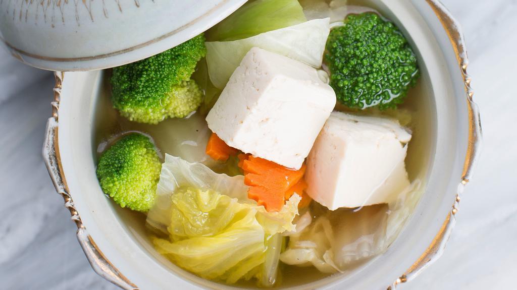 Tofu Soup · A light, flavorful soup made with a clear broth, tofu, mushrooms, spring onions, cabbage, carrots, broccoli, cilantro, and fresh chopped scallions.