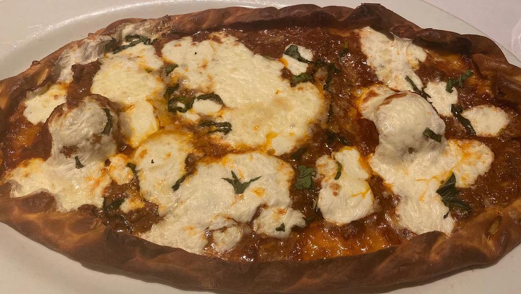 Open Faced Lasagna Bolognese · whole milk mozzarella, meat sauce, burrata mozzarella, meatballs, bas.