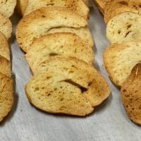 Home-Made Bagel Chips 8Oz Bag · Thinly sliced Bagels brushed with Olive Oil, sprinkled with Sea Salt and Garlic, and then ba...