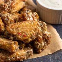 Garlic Parmesan Wings - Bone-In · Classic bone-in wings fried, topped with Garlic Parmesan sauce, cooked to order and perfectl...
