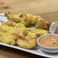 Chicken Satay · Grilled marinated chicken skewers served with peanut sauce and cucumber vinaigrette.