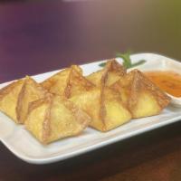 Crab Rangoon · Stuffed with imitation crab meat in wonton skin with cream cheese. Diced onions, carrots ser...