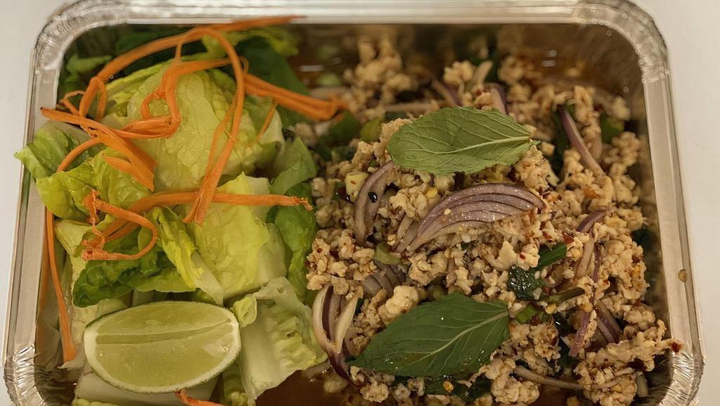 Chicken Larb · Larb gal is a popular dish in thailand consisting of browned ground chicken, mint, scallions, red onions, ground roasted rice, ground red chilis and cilantro dressed with a fish sauce lime juice. Spicy.