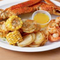 1/2 Snow Crab Legs  + Shrimps  · One cluster of snow crab legs and shrimp that comes with two sides of your choice.