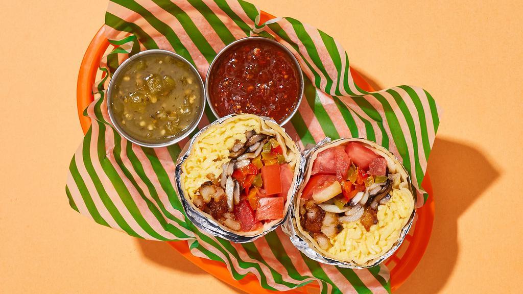 Cozy Veggie Breakfast Burrito · Two scrambled eggs with crispy potatoes, sauteed peppers and onions, mushrooms, and tomatoes.