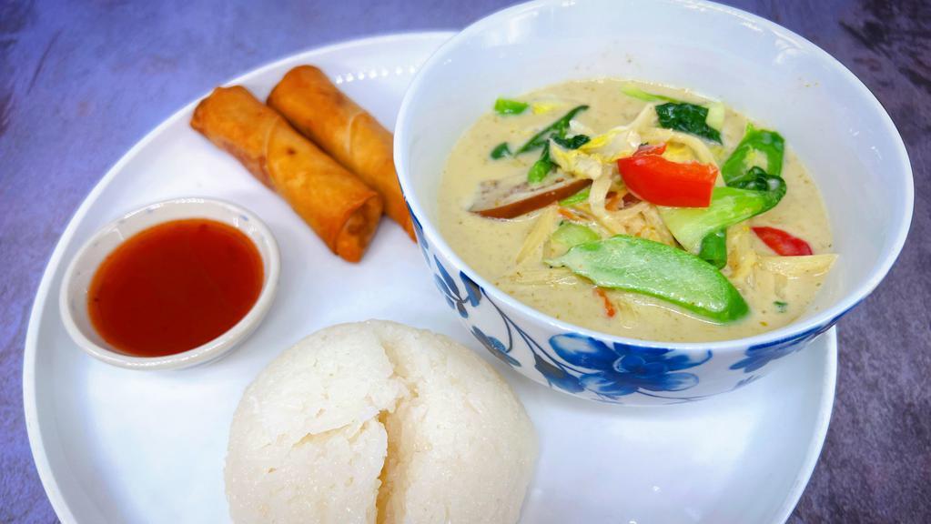 L14=Green Curry · Spicy. String bean, eggplant, bamboo shoot, bell pepper and basil. Includes your choice of starter. Served with jasmine rice.