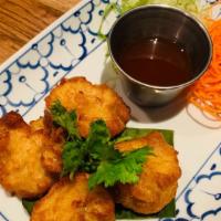 Fried(Th)Dumpling · Mixed chicken and shrimp,sesame oil served with sweet chili sauce on side.