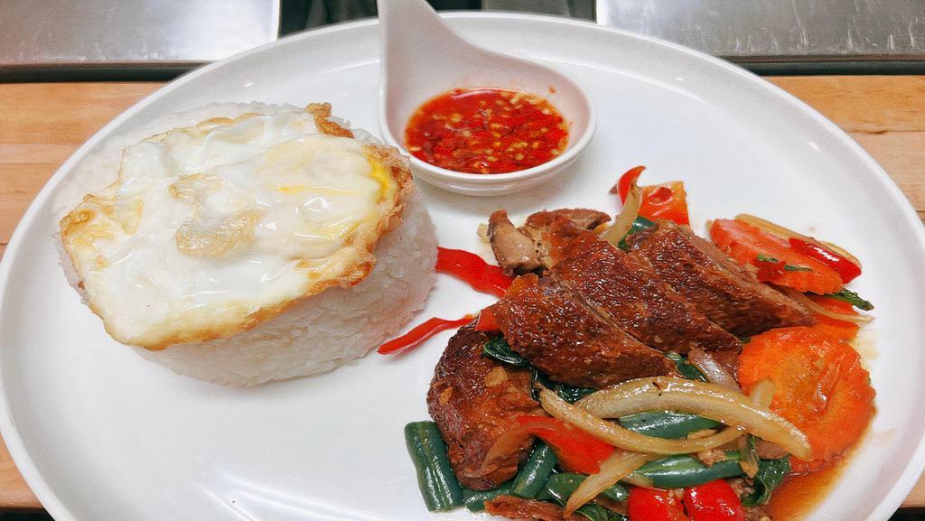 Ka Pao Ped · *Duck Basil Over Rice*
Crispy duck with fried egg over rice onion, bell pepper and basil leaves.

PrikNamPla = Fresh Chilli in Fish Sauce