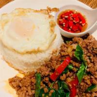 Cs09=Minced Beef Basil With Egg Over Rice · Served with “Prik Nam pla”. 

Priknampla= Fresh Chili in Fish sauce.
