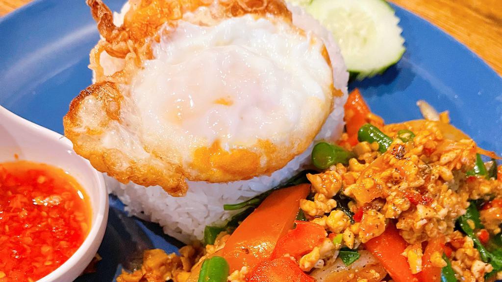 Cs07=Minced Chicken Basil Sauce Over Rice · Served with Fried Egg. 
Priknampla= Fresh Chili in Fish sauce.