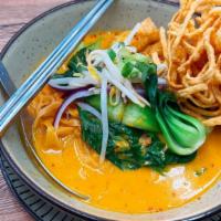 N10=Khao Soi (Egg Noodle Curry) · Egg noodles with yellow curry, mixed with red onions, scallions, bean sprouts, and bok choy.