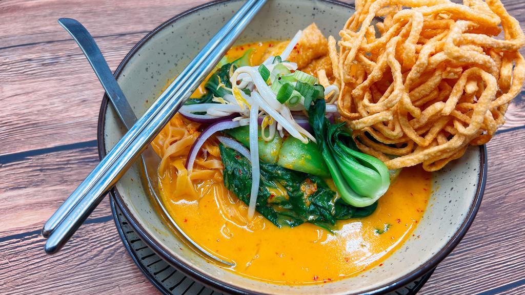 N10=Khao Soi (Egg Noodle Curry) · Egg noodles with yellow curry, mixed with red onions, scallions, bean sprouts, and bok choy.