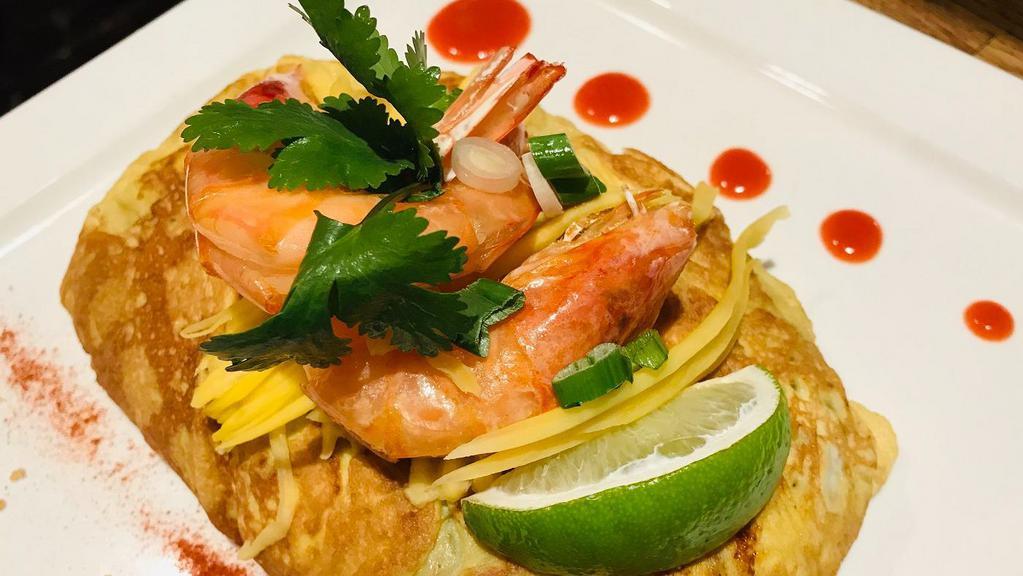 N16=Pad Thai Big Shrimp-Gf · Gluten free ํ 
We just upgraded our famous Pad Thai to another level! “ Glass noodle Pad Thai with Shrimp wrapped in egg “ cook with our special sauce and flavorful mango mixed in noodle and more on the top.