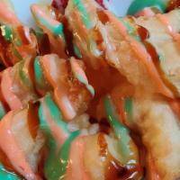 Rock Shrimp Tempura · Crunchy rock shrimp tempura, served with spicy aioli and fresh seasonal fruits.
