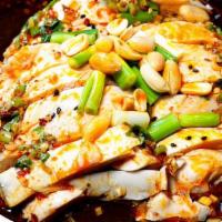 Steamed Chicken With Chili Sauce 口水鸡 · Sliced chicken, cilantro, celery, peanut, and served cold.