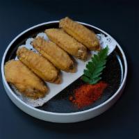 Spicy Chicken Wings (6)香辣鸡翅 · Fried chicken wings.