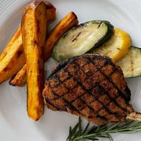 Pork Chop · This grilled pork chop pairs well with green beans and rice pilaf or sweet potatoes.