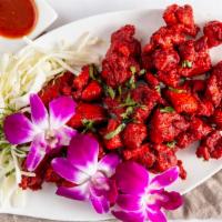Chicken 65  · Marinated chicken cooked with dry red chilies