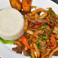 Saltado Carne · Grilled steak sautéed in red and green peppers, onions, fries and our special house made sau...