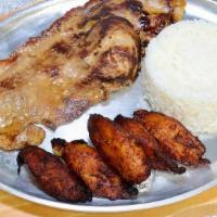 Lomo Plancha · Grilled pork loin served with two sides of your choice