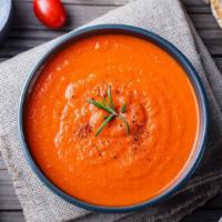 Tomato Soup · Traditionally prepared soup made of a mixture of chopped onions in olive oil until tender, t...