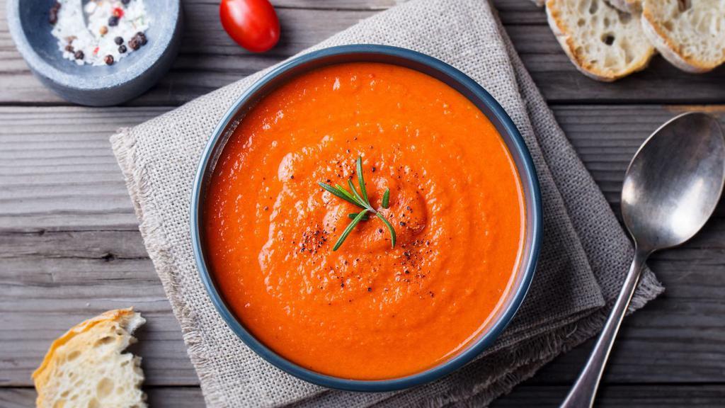 Tomato Soup · Traditionally prepared soup made of a mixture of chopped onions in olive oil until tender, then add tomato paste and veggie broth for a velvety smooth texture.