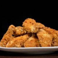 Chicken Wings · Traditionally prepared chicken wings deep-fried and breaded to a perfect crisp.
