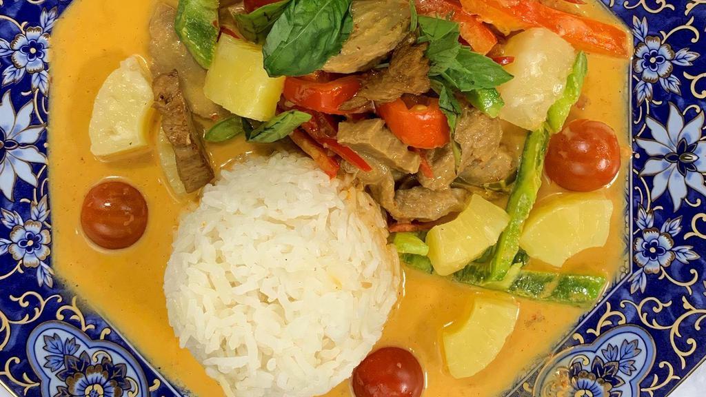 Vegan Red Curry  · Spicy red curry paste, coconut milk, eggplant, bell peppers, bamboo shoots, carrots, string beans and basil. Served with jasmine rice.