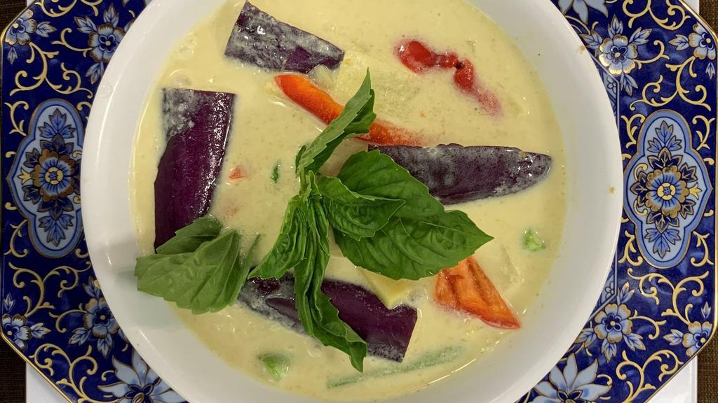 Vegan Green Curry · Spicy green curry paste, coconut milk, eggplant, bell peppers, bamboo shoots, carrots, string beans, and basil. Served with choice of rice.