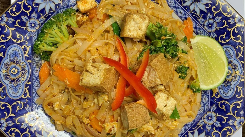 Vegan Pad Thai  · Rice noodles stir-fried with bean curd, bean sprouts, scallions and crushed peanuts. Served with choice of rice.