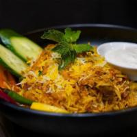 Shrimp Biryani · Layering marinated chicken with basmati rice along with our homemade herbs, saffron milk & g...