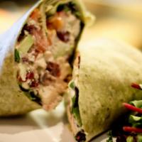 Chicken Salad Wrap · Our homemade granny smith apple, cranberry chicken salad with spring greens, and sliced toma...