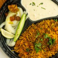 Vegetable Biryani · Fine grain basmati rice mixed with vegetables and spices cooked on slow fire.