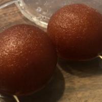 Gulab Jamun · Deep fried roundel of cottage cheese and flour in sweetened syrup.