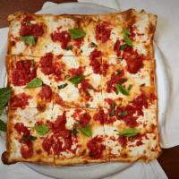 Our Famos Grandma Pizza  · Very thin   homemade dough crust pizza home 
chunky tomato fresh mozzarella and basil