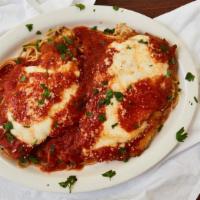 Chicken Parmigiana · Served with pasta salad and bread.