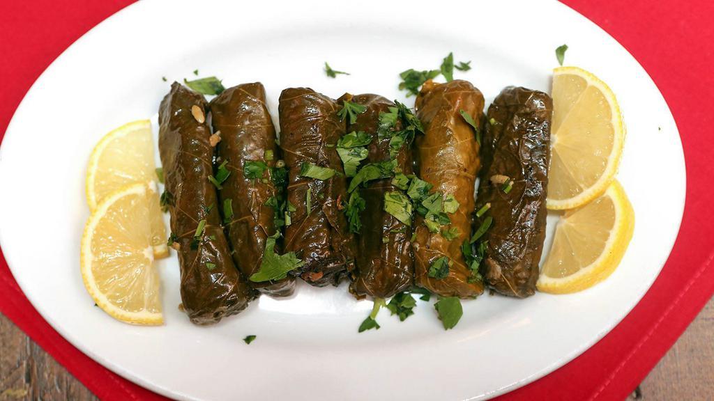 Grape Leaves · Hand rolled grape leaves stuffed with vegetables and rice.