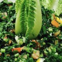 Tabouleh Salad · Cracked wheat, parsley, onion, tomato, lemon juice and olive oil.