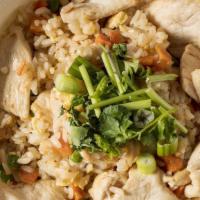 Chicken Fried Rice · Fragrant fried rice with diced tender chicken breast, egg, peas, and carrots.