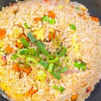 Veggie Fried Rice · Fragrant fried rice with eggs, peas, and carrots.