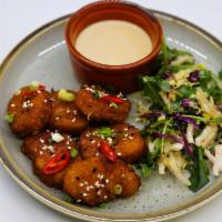Vegan Nuggets  · Vegan Nuggets tossed in the sauce of your choice
