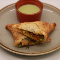 Paneer Puff · Crumbled spiced Paneer (Indian Cheese) with roasted peppers and Peas. Served with Mint Ranch...