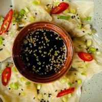 Chicken Momos · Chicken stuffed dumplings served with Soy and Chili sauce.