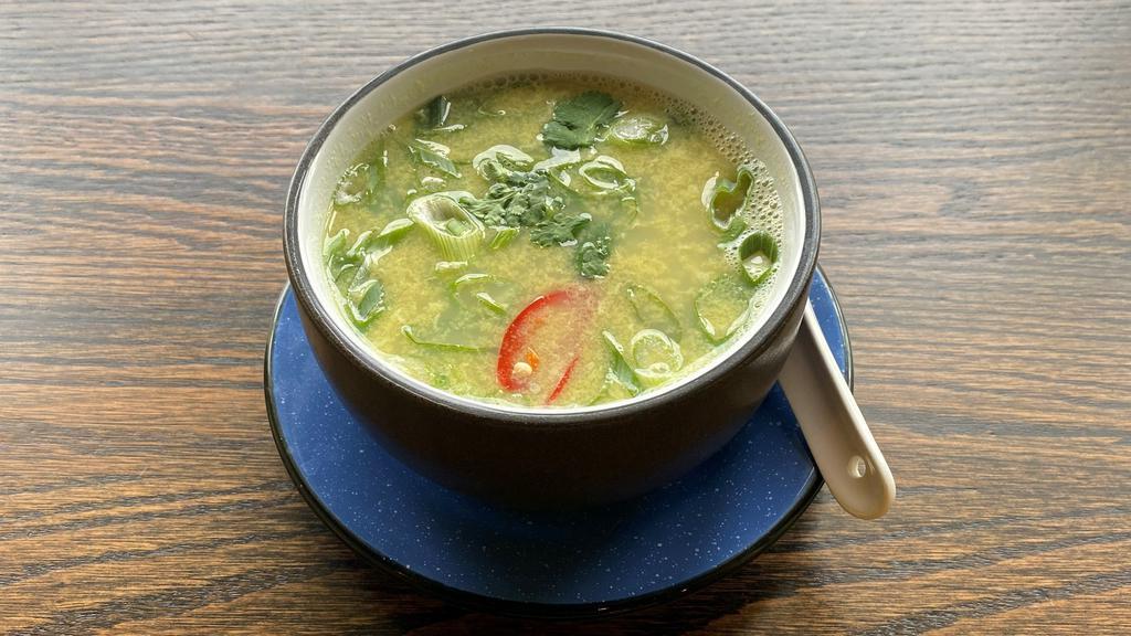 Sweet Corn Soup  · Corn in a vegetable stock with house herbs and Egg Ribbon.